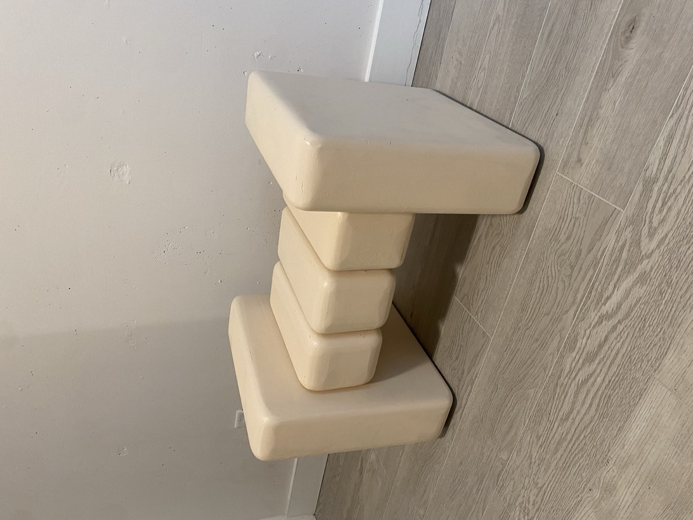 Five Smooth Stones: a bone-white footstool of five rounded Baltic birch plywood blocks on two dowels